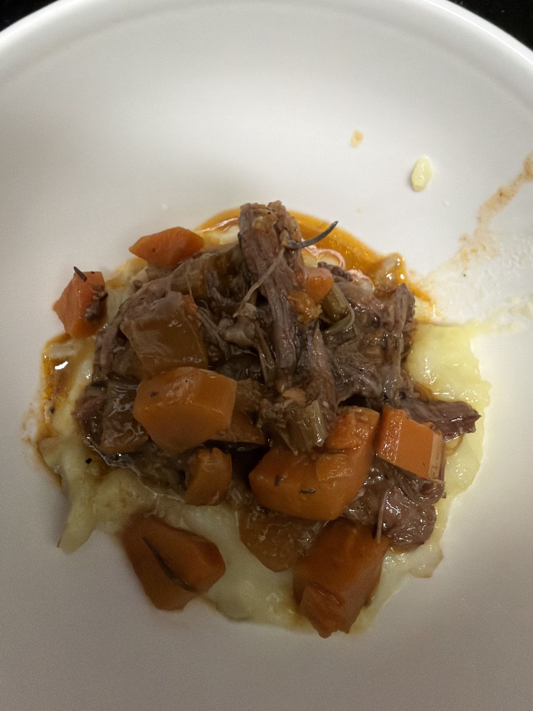Braised beef over whipped potatoes